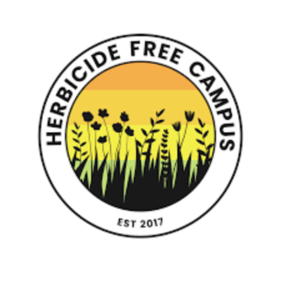 Plants and flowers sit inside a round shape with the words "Herbicide Free Campus" outlining the shape