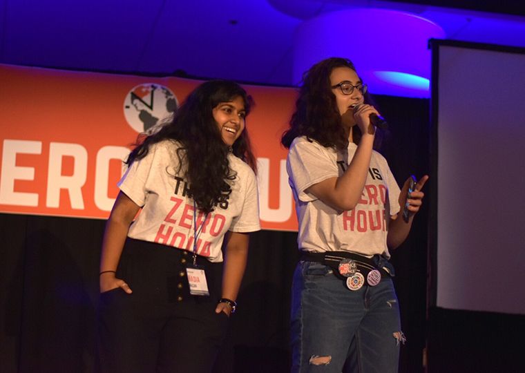 Young Zero Hour leaders speak from a stage.