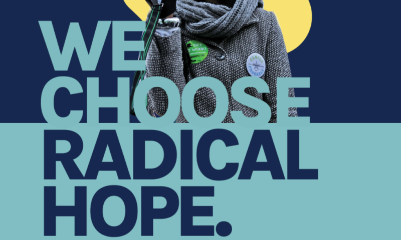 A color block of navy blue on the top half of the graphic and pale blue at the bottom half. At the top half of the graphic, a person has their moth wide open towards a megaphone. They wear a gray scarf and black gloves